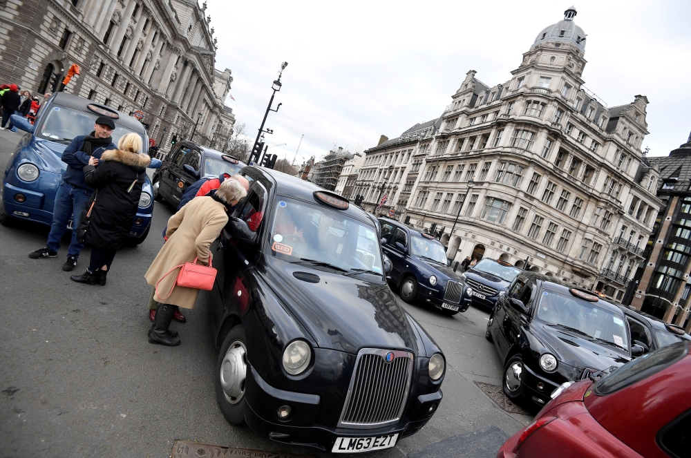 Taxi drivers block Parliament Square in a dispute over road access, in London, Britain, in this file photo. — Reuters