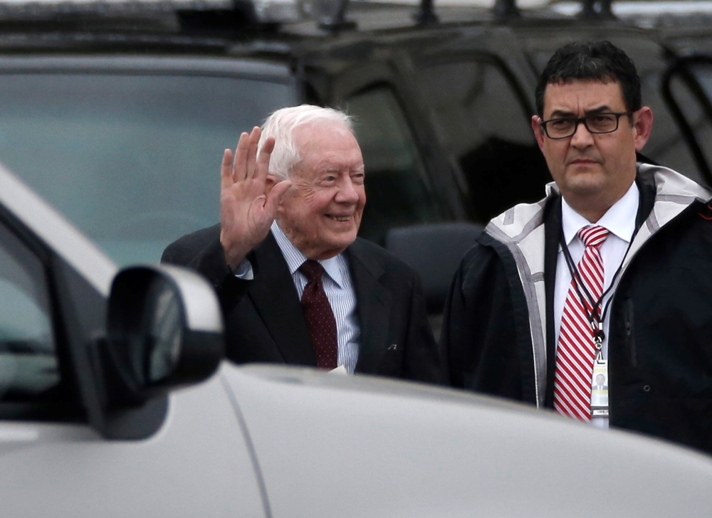 Former US President Jimmy Carter waves as he departs the Capitol after attending the presidential inauguration of Donald Trump in Washington in this Jan. 20, 2017 file photo. — Reuters