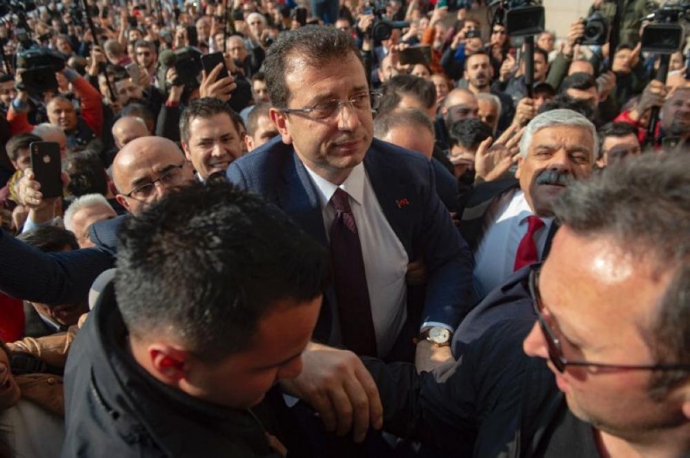Cheering supporters packed the streets to greet opposition candidate Ekrem Imamoglu, center, at the Istanbul court where he receives his mandate certificate in in this April 17, 2019 file photo. — AFP