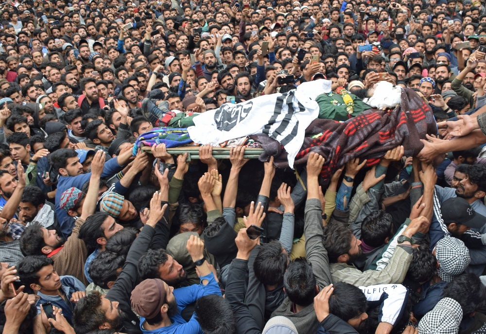 People carry the body of Naseer Ahmad Pandit, a separatist militant, during his funeral after he was killed in a gun battle with Indian soldiers, in Karimabad village in south Kashmir’s Pulwama district, on Thursday. — Reuters