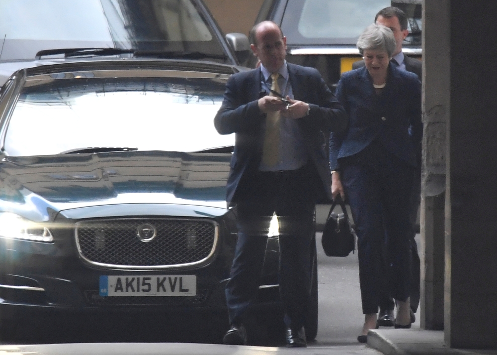 Britain’s Prime Minister Theresa May arrives at the Houses of Parliament in London on Thursday. —  Reuters