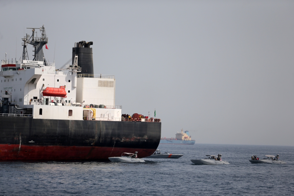 United Arab Emirates (UAE) Navy boats are seen next to the Saudi tanker Al Marzoqah off the Port of Fujairah, the UAE, in this May 13, 2019 file photo. — Reuters
