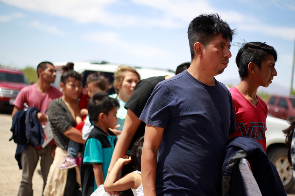 Central American migrants stand in line before entering a temporary shelter, after illegally crossing the border between Mexico and the US, in Deming, New Mexico, on Thursday. — Reuters