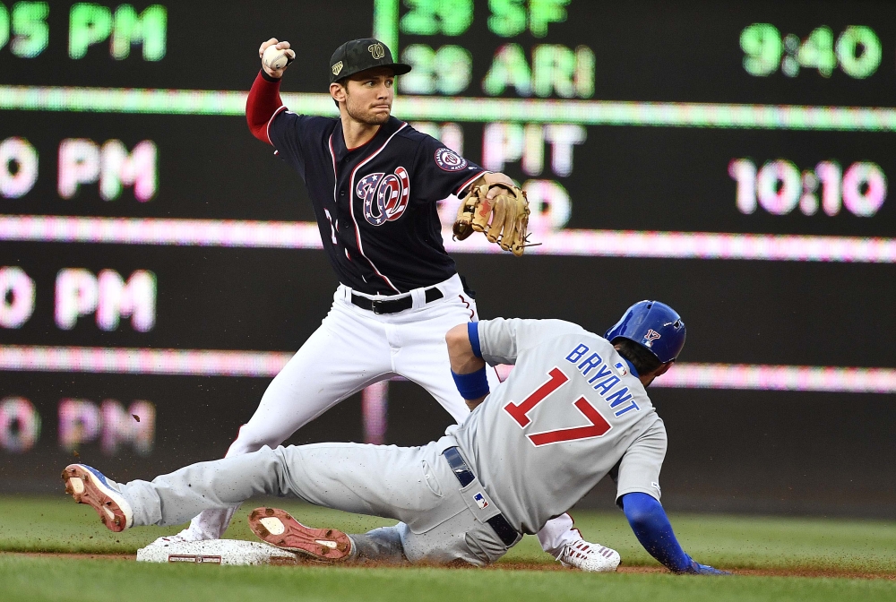 Washington Nationals shortstop Trea Turner (7) forces out Chicago Cubs third baseman Kris Bryant (17) and throws to first to complete a double play during the first inning at Nationals Park, Washington, in this May 17, 2019 file photo. — Reuters
