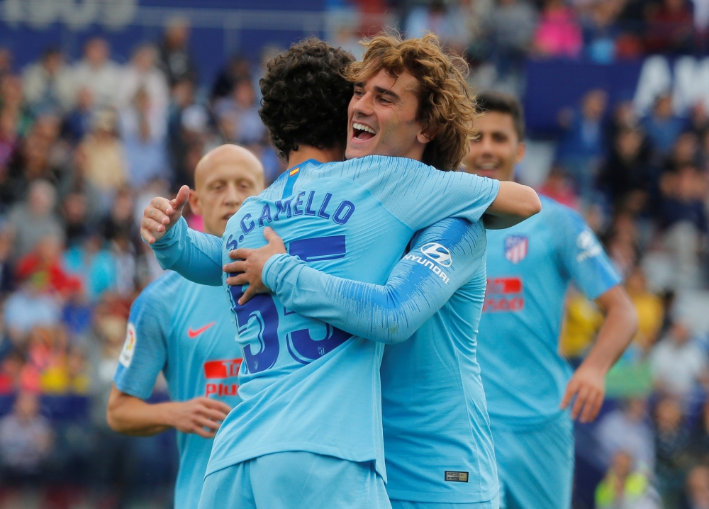 Valencia’s players celebrate qualifying for next season’s Champions League. — AFP 