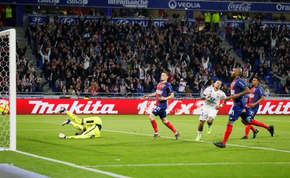 Lyon's Memphis Depay celebrates scoring their fourth goal in Lyon, France, on Saturday. — Reuters