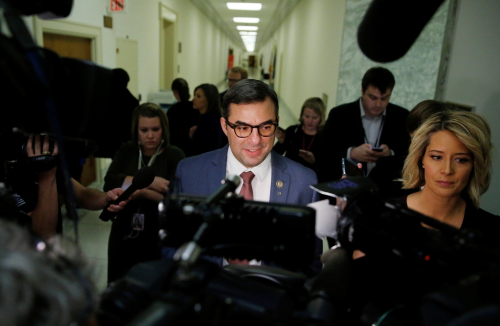House Freedom Caucus member Rep. Justin Amash (R-MI) talks to reporters on Capitol Hill after attending a White House meeting on the repeal of Obamacare in Washington, March 23, 2017. - Reuters