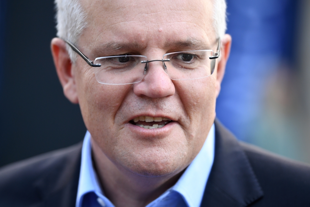 Prime Minister Scott Morrison speaks to the media as he arrives at the Horizon Church in Sutherland in Sydney, Australia, May 19. - Reuters