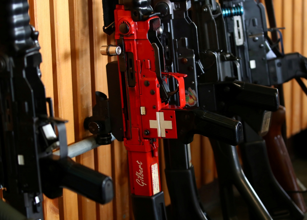 A rifle with a Swiss flag is pictured during a competition, ahead of a May 19 referendum on proposals to tighten weapon ownership laws in line with EU steps, in Romont, Switzerland. — Reuters