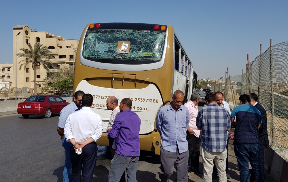 A damaged bus is seen at the site of a blast near a new museum being built close to the Giza pyramids in Cairo, Egypt. — Reuters