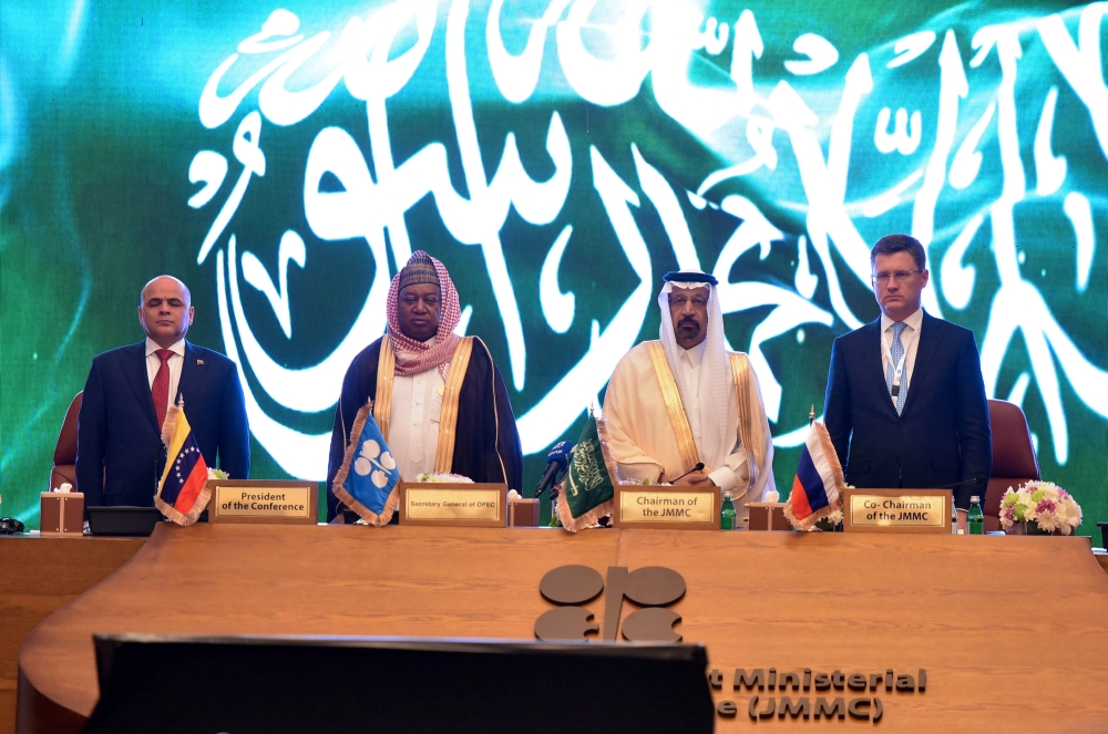 Saudi Arabian Energy Minister Khalid Al-Falih, Mohammed Barkindo, Secretary General of OPEC, Russian Energy Minister Alexander Novak and Venezuela's Oil Minister Manuel Quevedo stand for the Saudi Arabia anthem during the OPEC 14th Meeting of the Joint Ministerial Monitoring Committee in Jeddah on Sunday. — Reuters