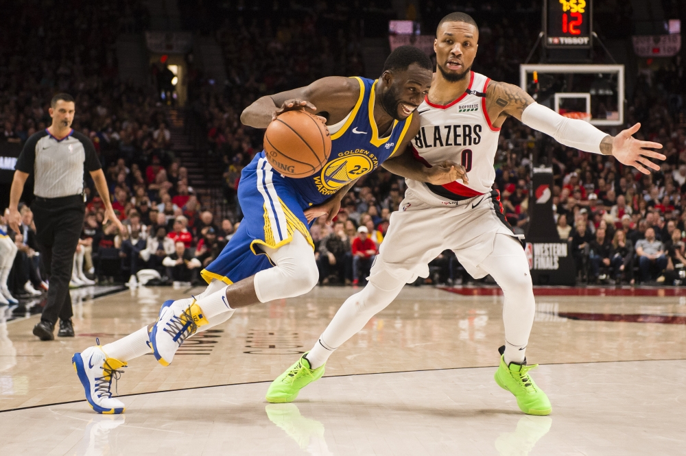Golden State Warriors forward Draymond Green (23) drives to the basket against Portland Trail Blazers guard Damian Lillard (0) during the second half in game three of the Western conference finals of the 2019 NBA Playoffs at Moda Center on Saturday. — Reuters