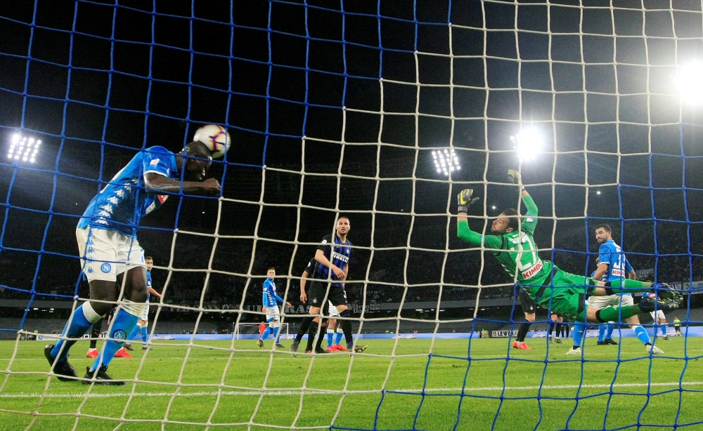 Napoli's Kalidou Koulibaly and Orestis Karnezis in action. —  REUTERS