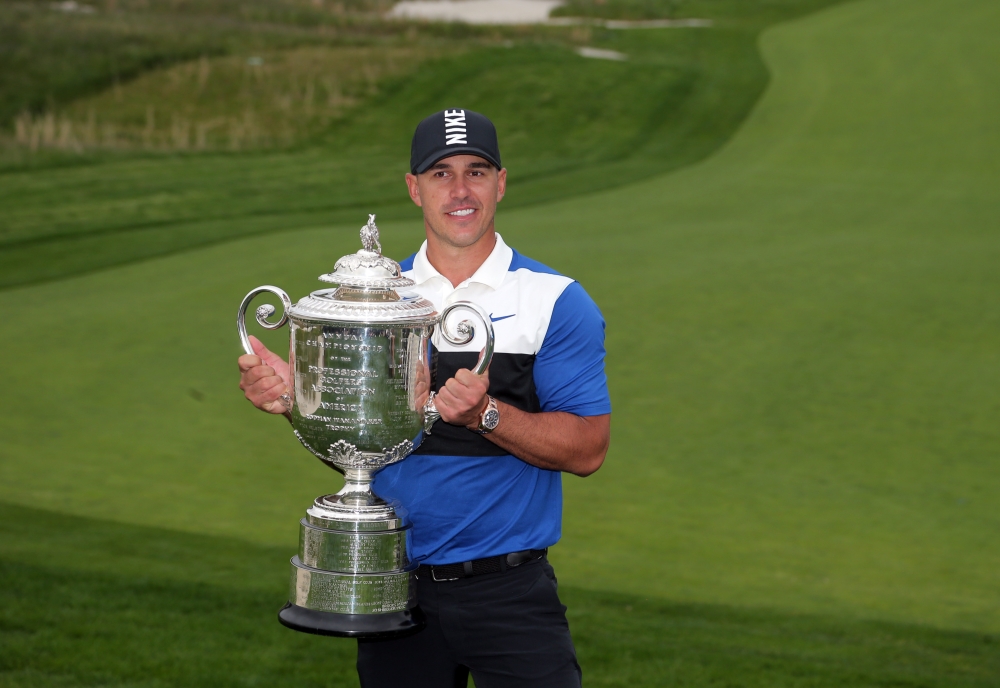 May 19, 2019; Bethpage, NY, USA; Brooks Koepka celebrates with the Wanamaker Trophy after winning the PGA Championship golf tournament at Bethpage State Park - Black Course. Mandatory Credit: Peter Casey-USA TODAY Sports