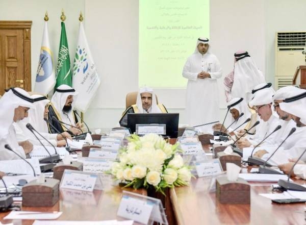 MWL officials discuss distribution of Ramadan food packets among the poor. — Okaz photo