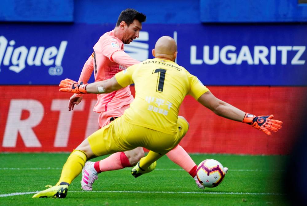 Barcelona's Lionel Messi scores their first goal  against Eibar in the La Liga match at  Ipurua, Eibar, Spain, on Sunday. — Reuters