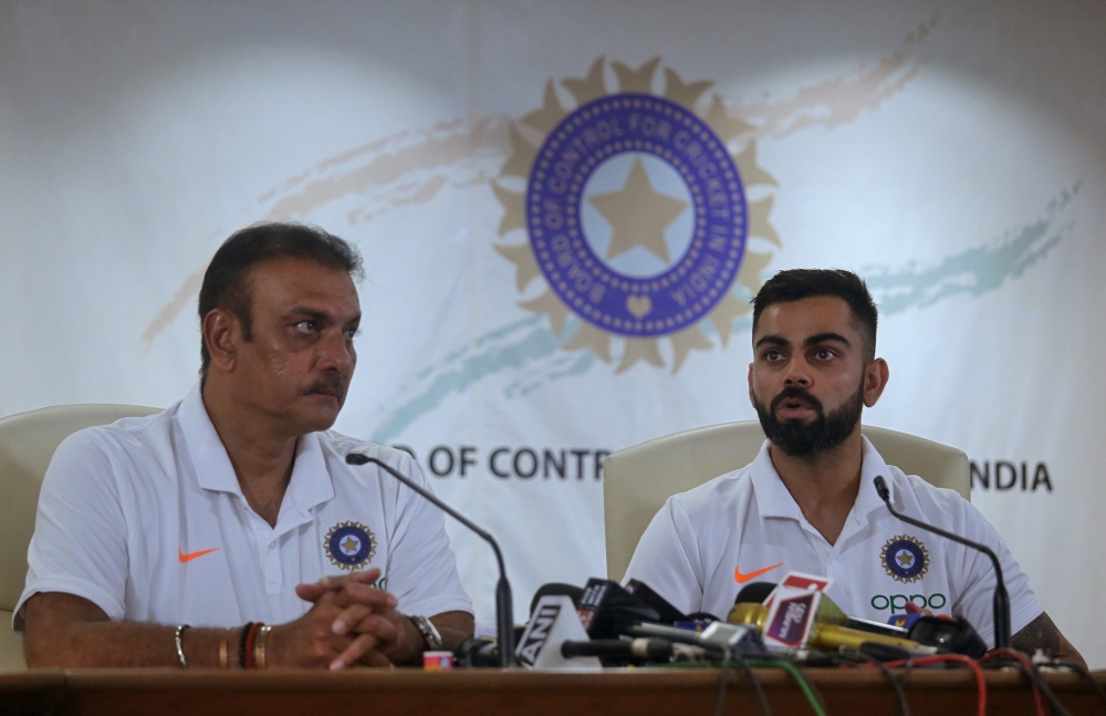 India's captain Virat Kohli speaks as head coach Ravi Shastri looks on during a news conference at the Board of Control for Cricket in India (BCCI) headquarters in Mumbai, India, on Tuesday. — Reuters