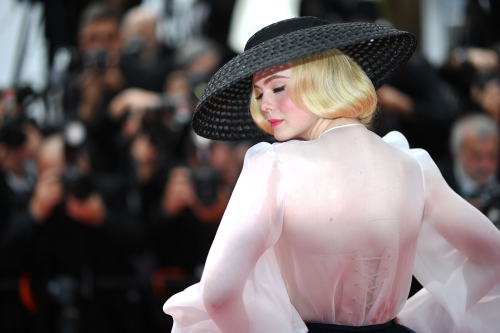 US actress and member of the jury of the Cannes Film Festival Elle Fanning poses as she arrives for the screening of the film 