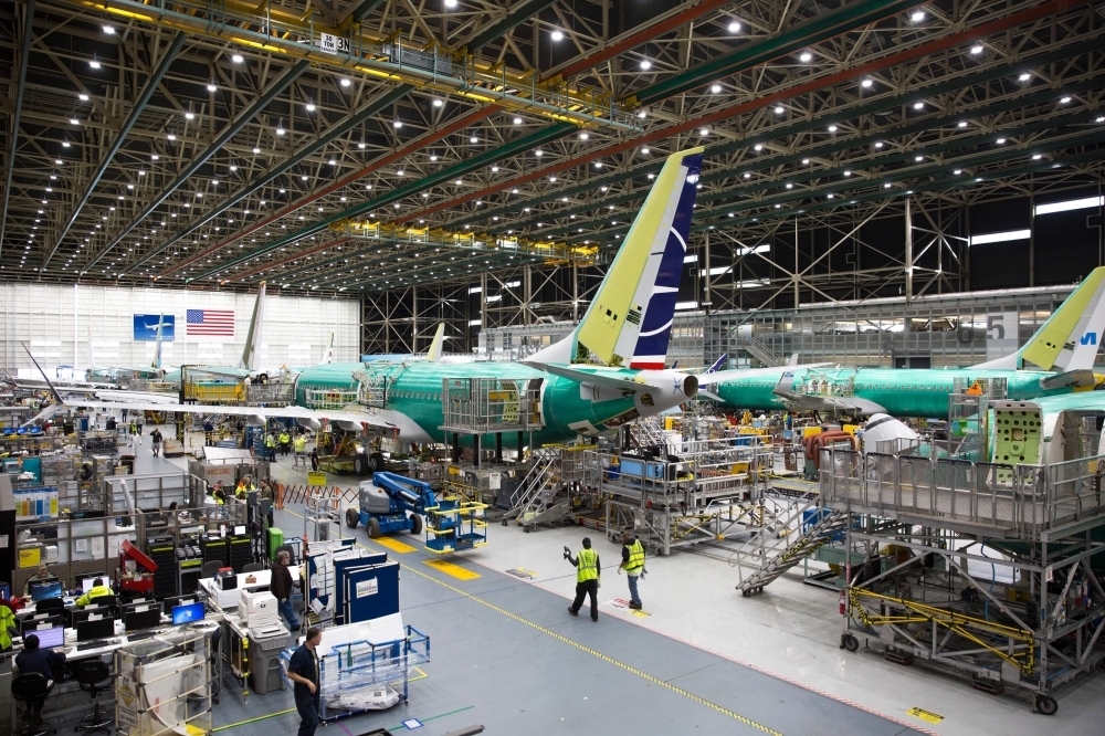 In this file photo taken on March 27, 2019, employees work on Boeing 737 MAX airplanes at the Boeing Renton Factory in Renton, Washington. — AFP