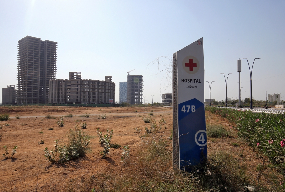 A billboard stands in front of buildings under construction at the Gujarat International Finance Tec-City (GIFT) at Gandhinagar, in the western state of Gujarat, in this file photo. — Reuters