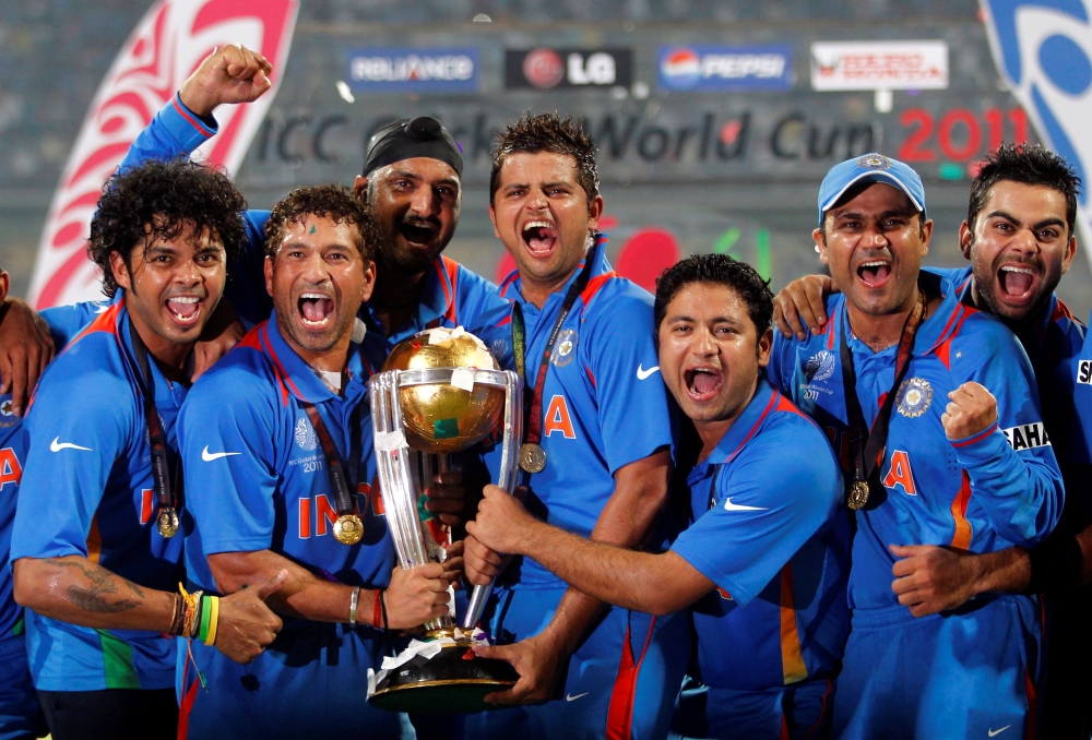 India's Shanthakumaran Sreesanth, Sachin Tendulkar, Harbhajan Singh, Suresh Raina, Piyush Chawla, Virender Sehwag and Virat Kohli (L-R) celebrate with their trophy after India won their ICC Cricket World Cup final match against Sri Lanka in Mumbai on April 2, 2011. — Reuters