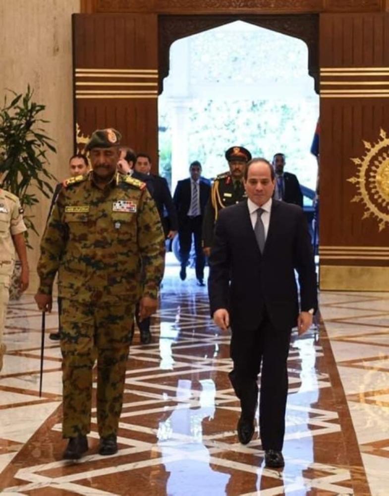 Egypt's President Abdel Fattah El-Sisi (right) receives Sudan's ruling military council chief Abdel Fattah Al-Burhan in Cairo on Saturday.