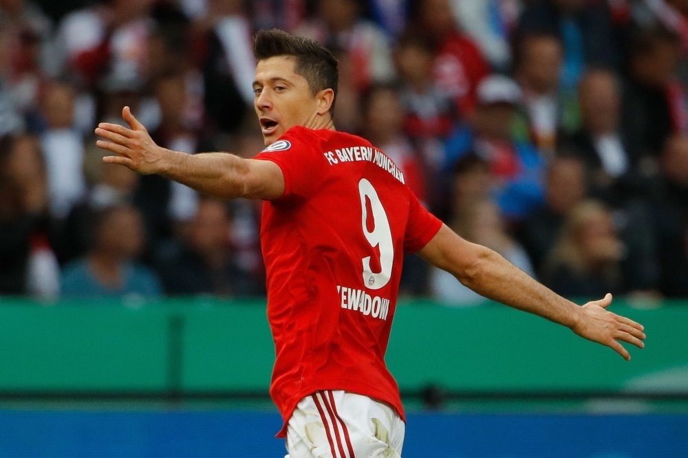 Bayern Munich's Polish forward Robert Lewandowski celebrates scoring the opening goal during the German Cup (DFB Pokal) final football match against RB Leipzig at the Olympic Stadium in Berlin on Saturday. — AFP