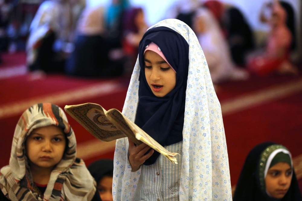 The blessed Qur'an

Iraqi children read the Holy Qur'an in Baghdad during the holy month of Ramadan.  — AFP