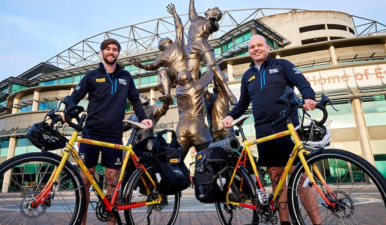 Ron Rutland (foreground) and James Owen are cycling from London to Tokyo to deliver the referee whistle for the opening game of the Rugby World Cup. Courtesy DHL