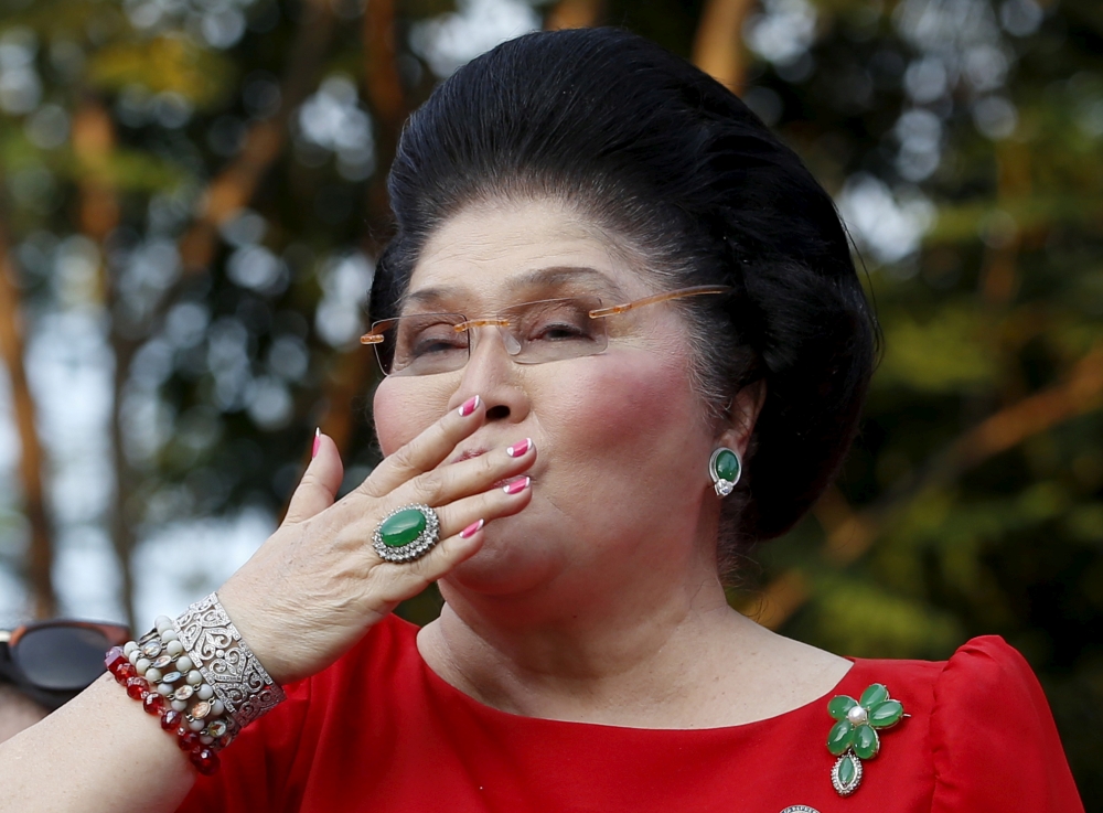 Former Philippine first lady Imelda Marcos blows a kiss to supporters in Manila in this Oct. 10, 2015 file photo. — Reuters