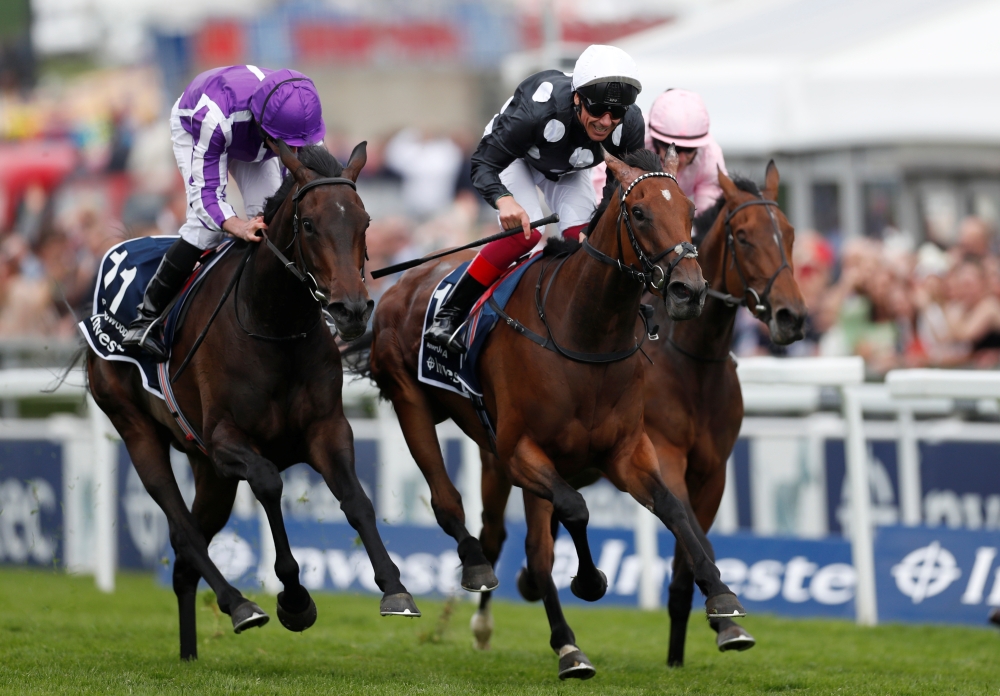 Anapurna ridden by Frankie Dettori wins the 4.30 Investec Oaks in the Derby Festival at the Epsom Downs Racecourse, Epsom, Britain, on Friday. — Reuters