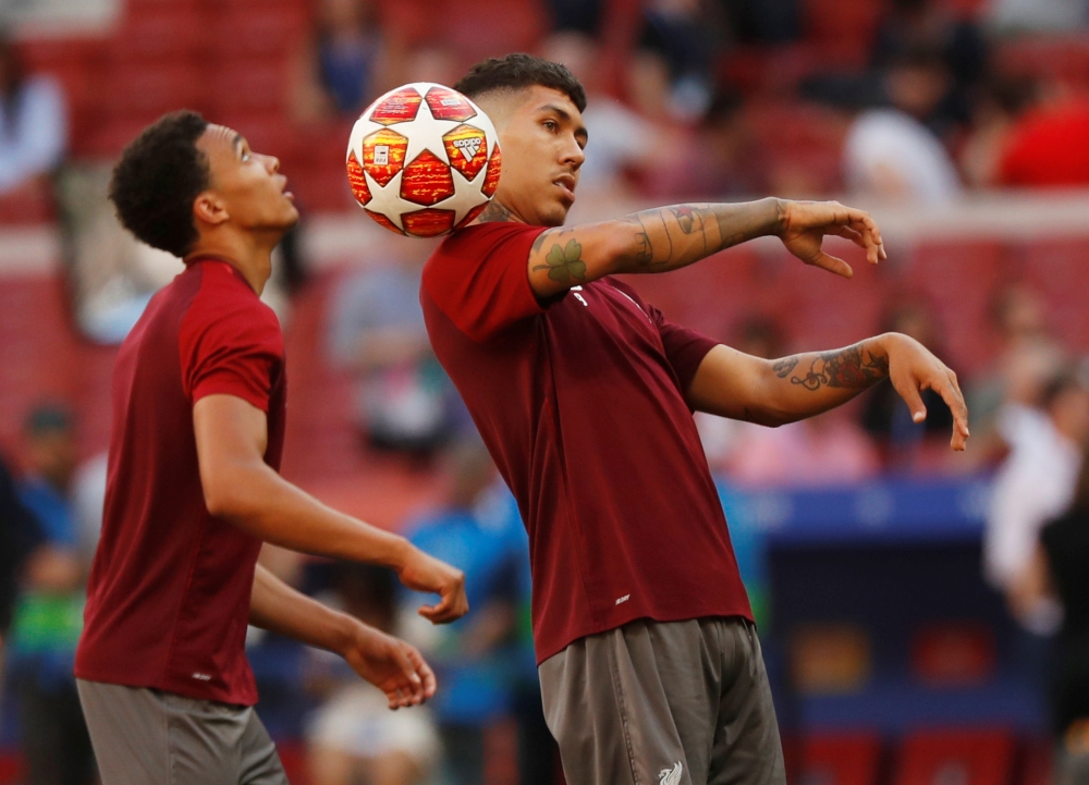 Liverpool's Roberto Firmino and Trent Alexander-Arnold during training at the Wanda Metropolitan Stadium in Madrid on Friday on the eve of the UEFA Champions League final football match against Tottenham Hotspur. — Reuters