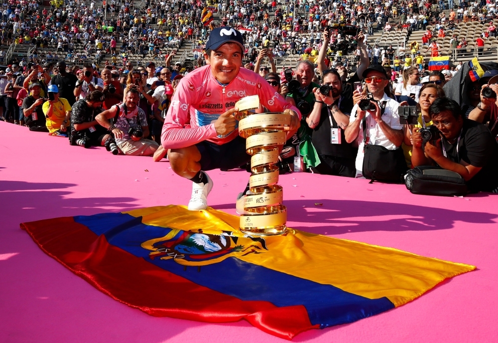 Overall race winner Team Movistar rider Ecuador's Richard Carapaz poses with the 