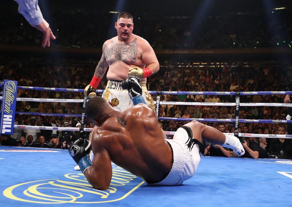 Andy Ruiz Jr knocks down Anthony Joshua in the third round during their IBF/WBA/WBO heavyweight title fight at Madison Square Garden on Saturday in New York City. — AFP