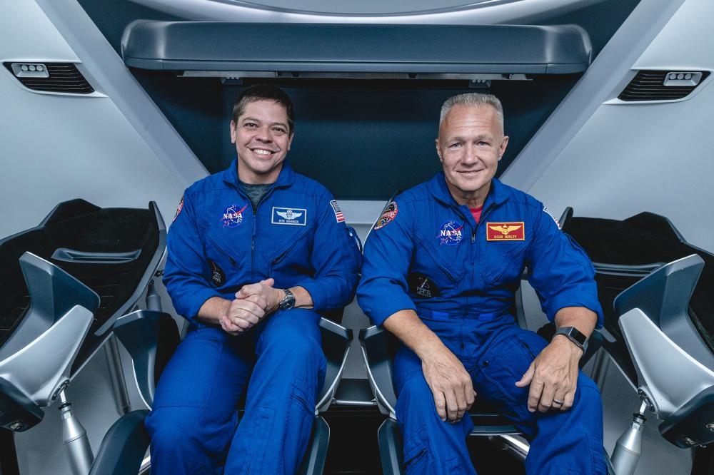 NASA astronauts, from left, Bob Behnken and Doug Hurley, assigned to fly on SpaceX’s Demo-2 test flight of its Crew Dragon, are inside a mockup of the spacecraft at NASA’s Johnson Space Center in Houston in this Aug. 2, 2018 file picture. — Courtesy photo