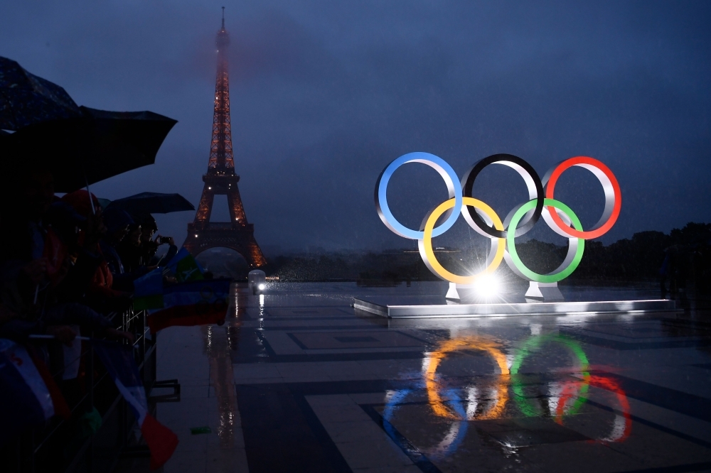 In this file photo taken on September 13, 2017 a picture shows the Olympics Rings on the Trocadero  Esplanade near the Eiffel Tower in Paris, after the  International Olympic Committee named Paris host city of the 2024 Summer Olympic Games. Energy giants Total has ruled out sponsoring the 2024 Olympics in Paris, keen to avoid being 