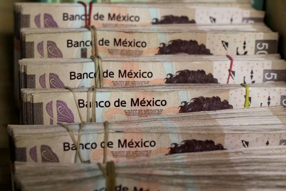 Bundles of Mexican Peso banknotes are pictured at a currency exchange shop in Ciudad Juarez, Mexico in this file photo. — Reuters