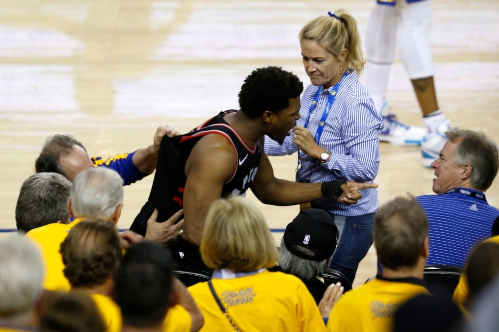 Kyle Lowry #7 of the Toronto Raptors yells at investor Mark Stevens in the second half against the Golden State Warriors during Game Three of the 2019 NBA Finals at ORACLE Arena in Oakland, California, on Wednesday. — AFP