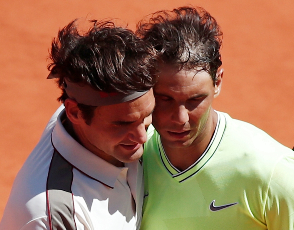Switzerland's Roger Federer and Spain's Rafael Nadal after their French Open semifinal match at the Roland Garros, Paris, France, on Friday. — Reuters