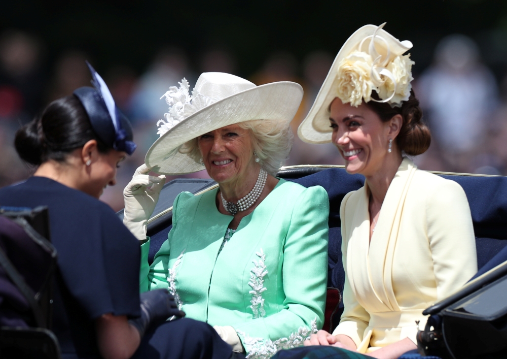 (L-R) Britain's Prince William, Duke of Cambridge holding Prince Louis, Prince George, Princess Charlotte, Britain's Catherine, Duchess of Cambridge, Britain's Camilla, Duchess of Cornwall, Vice Admiral Timothy Laurence, Britain's Prince Charles, Prince of Wales, Britain's Princess Beatrice of York, Britain's Princess Anne, Princess Royal,, Britain's Queen Elizabeth II, Britain's Princess Eugenie of York, Britain's Lady Louise Windsor, Britain's Prince Andrew, Duke of York,, Britain's Prince Harry, Duke of Sussex, Britain's Meghan, Duchess of Sussex, James, Viscount Severn and Isla Phillips stand with other members of the Royal Family on the balcony of Buckingham Palace to watch a fly-past of aircraft by the Royal Air Force, in London on Saturday. — AFP