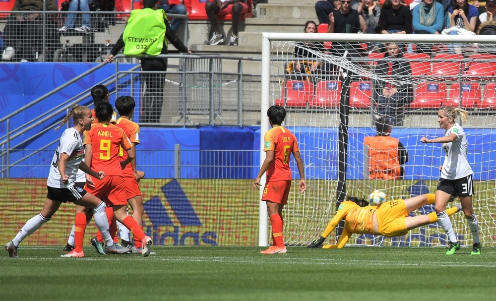 Germany's defender Giulia Gwinn (L) scores a goal during the France 2019 Women's World Cup Group B football match against China, on Saturday, at the Roazhon Park stadium in Rennes, western France. — AFP
