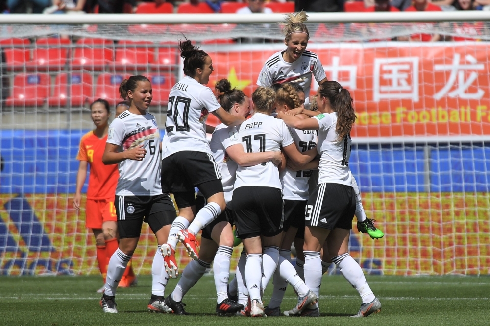 Germany's defender Giulia Gwinn (L) scores a goal during the France 2019 Women's World Cup Group B football match against China, on Saturday, at the Roazhon Park stadium in Rennes, western France. — AFP
