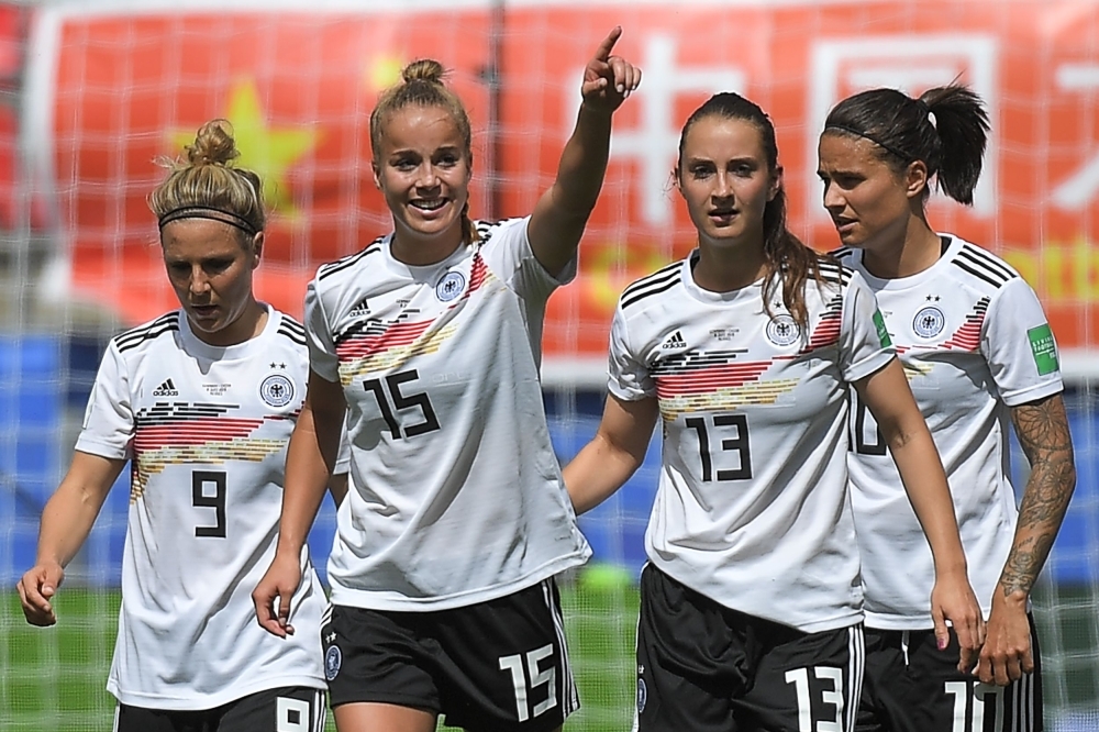 Germany's defender Giulia Gwinn (L) scores a goal during the France 2019 Women's World Cup Group B football match against China, on Saturday, at the Roazhon Park stadium in Rennes, western France. — AFP