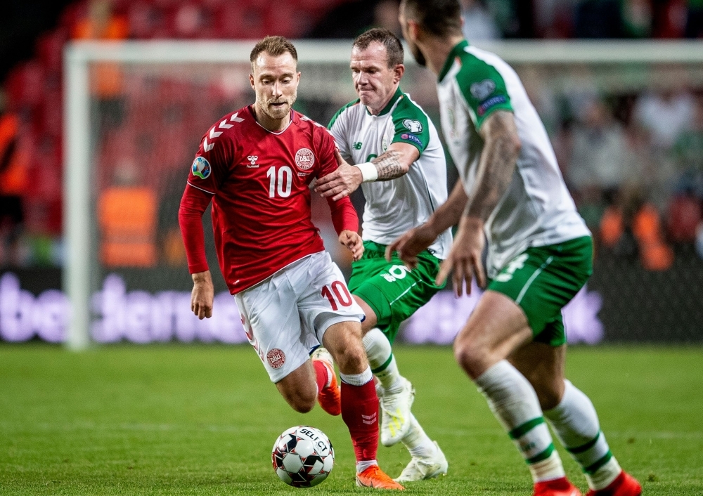 Denmark's Christian Eriksen (L) vies with Ireland's Glenn Whelan during the UEFA Euro 2020 qualifying football match in Telia Parken on Friday. — AFP