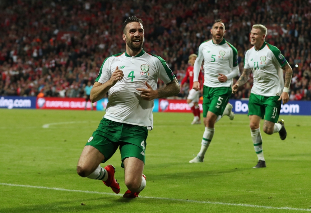 Denmark's Christian Eriksen (L) vies with Ireland's Glenn Whelan during the UEFA Euro 2020 qualifying football match in Telia Parken on Friday. — AFP