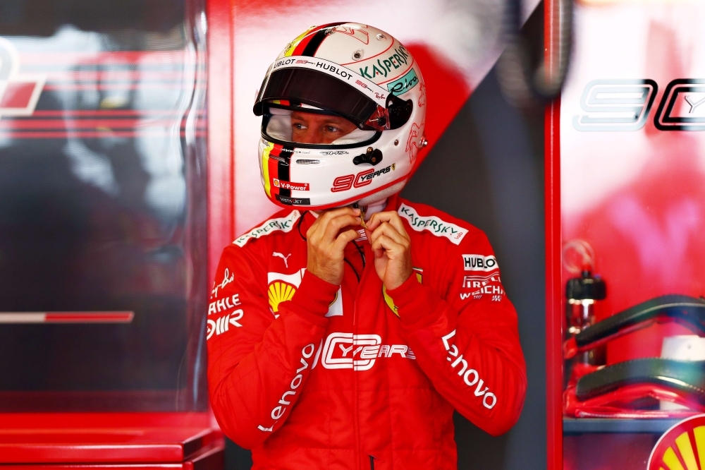 Top three qualifiers Sebastian Vettel of Germany and Ferrari, Lewis Hamilton of Great Britain and Mercedes GP and Charles Leclerc of Monaco and Ferrari celebrate in parc ferme during qualifying for the F1 Grand Prix of Canada at Circuit Gilles Villeneuve on Saturday in Montreal, Canada. — AFP