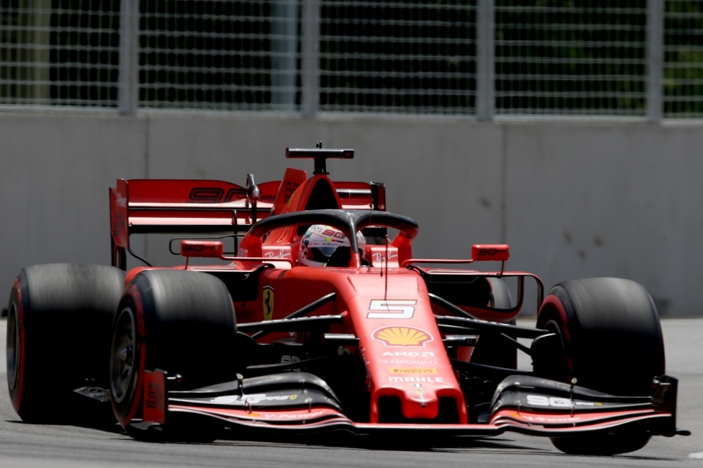 Top three qualifiers Sebastian Vettel of Germany and Ferrari, Lewis Hamilton of Great Britain and Mercedes GP and Charles Leclerc of Monaco and Ferrari celebrate in parc ferme during qualifying for the F1 Grand Prix of Canada at Circuit Gilles Villeneuve on Saturday in Montreal, Canada. — AFP
