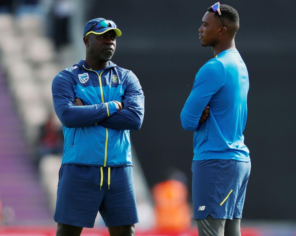 South Africa's head coach Ottis Gibson with Lungi Ngidi before the ICC Cricket World Cup match against India at the Ageas Bowl, Southampton, Britain. — Reuters