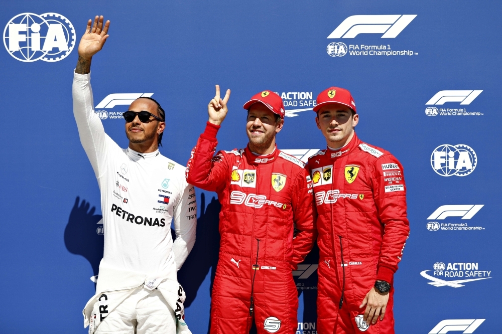 Top three qualifiers Sebastian Vettel of Germany and Ferrari, Lewis Hamilton of Great Britain and Mercedes GP and Charles Leclerc of Monaco and Ferrari celebrate in parc ferme during qualifying for the F1 Grand Prix of Canada at Circuit Gilles Villeneuve on Saturday in Montreal, Canada. — AFP