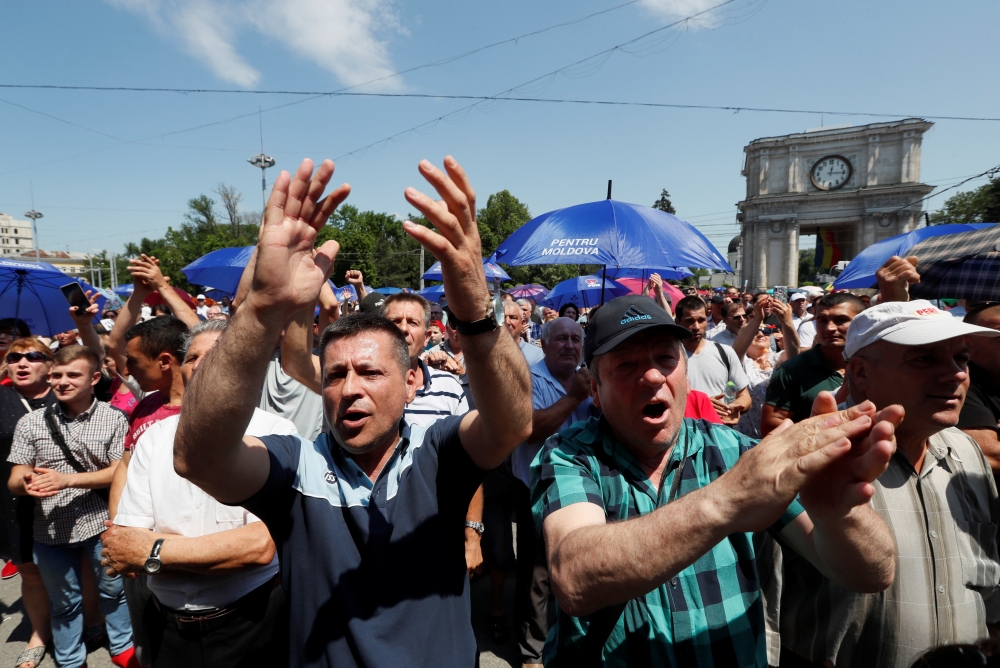 Supporters of Democratic Party of Moldova attend a rally demanding a creation of parliament coalition, in Chisinau, Moldova, Sunday. — Reuters